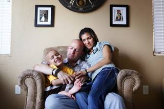 Jennica and Matthew LeBaron with their son Caleb, 6, inside their home in North Las Vegas on Friday, Feb. 17, 2012.