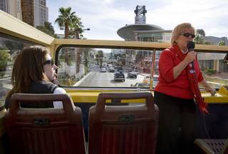 Tour guide Susan Abramson gives information about the sights during an open top sightseeing bus tour of the Las Vegas Strip Wednesday, Feb. 22, 2012. The tour company is expanding and has doubled it's Las Vegas workforce in the last four months, said general manager Chris Crompton. The Las Vegas operation has 65 employees, he said.