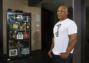 Boxer Mike Tyson, former undisputed heavyweight champion, poses at his home in Henderson Friday, Feb. 24, 2012. Tyson will star in "Mike Tyson: Undisputed Truth - Live on Stage," a one-man show on the Strip.