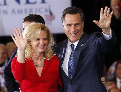 Republican presidential candidate, former Massachusetts Gov. Mitt Romney, waves to supporters with his wife Ann at his election watch party after winning the Michigan primary in Novi, Mich., Tuesday, Feb. 28, 2012. (AP Photo/Gerald Herbert)