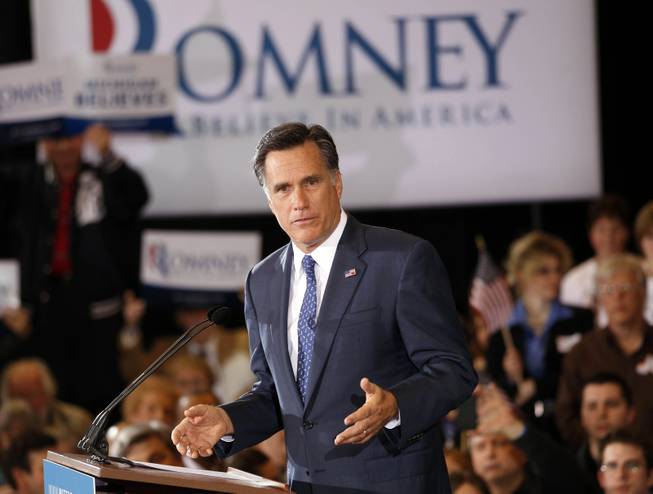 Mitt Romney speaks to supporters at his election watch party Tuesday after winning the Michigan primary in Novi, Mich.