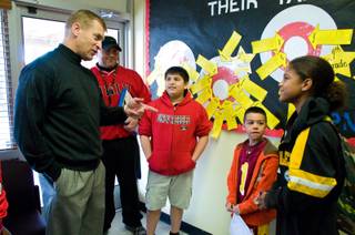 UNLV football coach Bobby Hauck talks with students at Crestwood Elementary School, Wednesday Feb. 29, 2012.