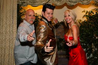John Walker, 52, and Debbie Dieterich, 48, strike a pose with Elvis after he married them on Wednesday, February 29, 2012, at the Viva Las Vegas Wedding Chapel on The Vegas Strip.