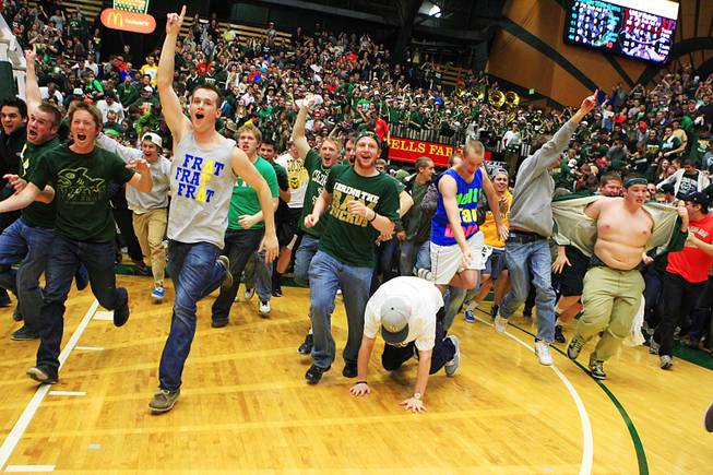 Colorado State fans rush the court after upsetting UNLV 66-59 Wednesday, Feb. 29, 2012 at Moby Arena in Ft. Collins.
