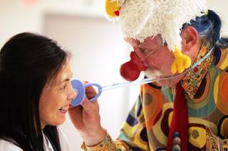 Dr. Patch Adams clowns with pediatric nurse practitioner Nikki Cuasay at the Children's Medical Center at Summerlin Hospital in Las Vegas on Thursday, March 1, 2012.