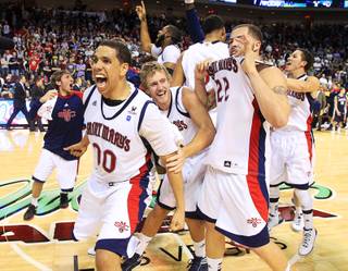 Saint Mary's Gaels' Brad Waldow (L) and teammates celebrate after beating the Gonzaga Bulldogs in 78-74 in overtime during the NCAA West Coast Conference Basketball Championship final in Las Vegas, Nevada March 5, 2012.