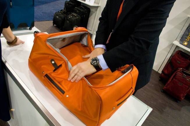 A demonstration of foldable Luggage by Biaggi at this year's Travel Goods Show in Las Vegas, Thursday March 8, 2012.