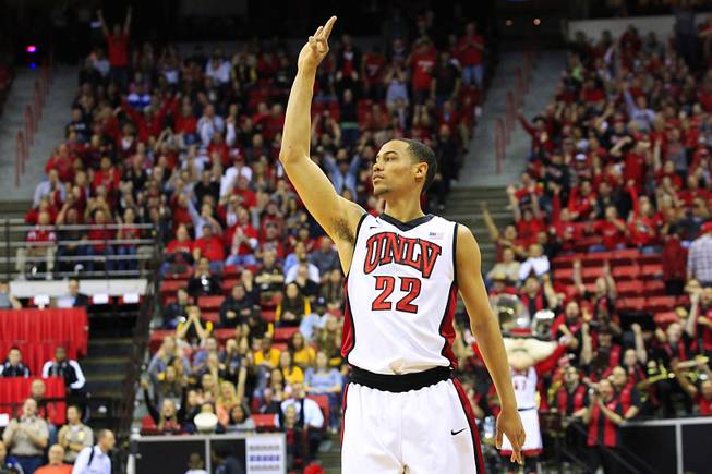 UNLV forward Chace Stanback signals a three-point shot against Wyoming during their Mountain West Conference Tournament game Thursday, March 8, 2012. UNLV won the game 56-48 and will face New Mexico in the semifinals.