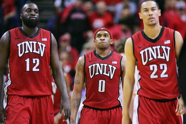 UNLV seniors Brice Massamba, Oscar Bellfield and Chace Stanback head to the bench during a time out in their game against at the Mountain West Conference tournament Friday, March 9, 2012 at the Thomas & Mack Center. New Mexico won 72-67 and will face San Diego State in the championship game.