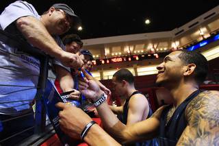 Anthony Marshall signs autographs after practice before their second round NCAA Men's Basketball Championship game Wednesday, March 14, 2012 at The Pit in Albuquerque. The Runnin' Rebels will take on Pac 12 champions Colorado on Thursday.