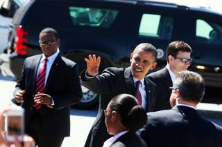 President Barack Obama greets people after arriving at McCarran Airport in Las Vegas on Wednesday, March 21, 2012.