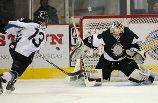 Wranglers goaltender Mitch O'Keefe foils a shootout attempt by Steelheads forward Ian Lowe on Saturday night as the two teams completed regulation time and an overtime period tied for the second night in a row at the Orleans Arena.