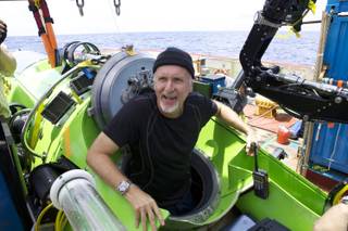 Filmmaker and National Geographic Explorer-in-Residence James Cameron emerges from the Deepsea Challenger submersible after his successful solo dive to the Mariana Trench, the deepest part of the ocean, Monday March 26, 2011. The dive was part of Deepsea Challenge, a joint scientific expedition by Cameron, the National Geographic Society and Rolex to conduct deep-ocean research.
