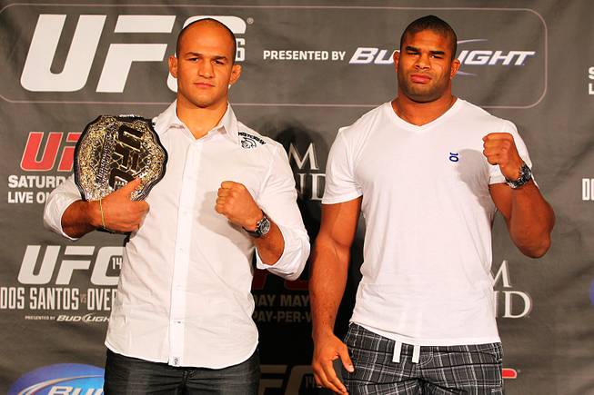 Junior Dos Santos, left, and Alistair Overeem pose for photos during a news conference Tuesday, March 27, 2012 to advance the all heavyweight card at UFC 146.