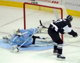 Wranglers forward Eric Lampe roofs a goal over the outstretched glove of Alaska goaltender Gerald Coleman for his 36th goal of the season on Tuesday night, March 27, 2012, at the Orleans Arena. With the goal, Lampe tied the Wranglers' single-season goal scoring record held by Peter Ferarro.
