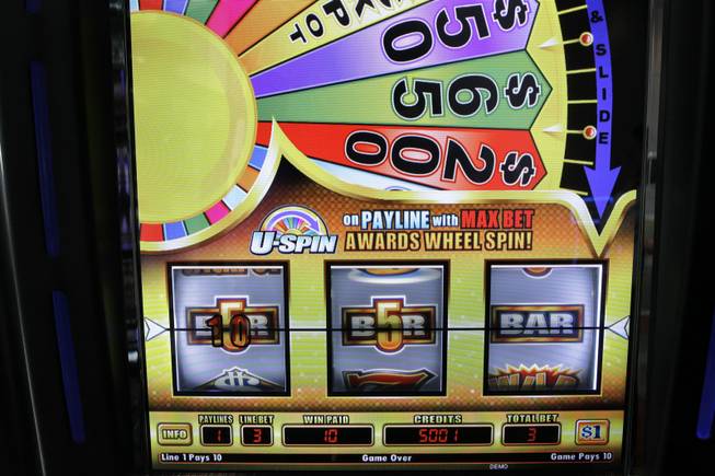 A Cash Spin slot machine by Bally Technologies is displayed in the company's showroom Thursday, March 29, 2012.