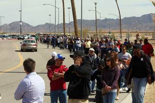 People wait in line to buy Mega Millions lottery tickets at the Primm Valley Lotto Store across the state line at Primm Thursday, March 29, 2012. 