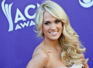 Carrie Underwood arrives at the 47th Annual Academy of Country Music Awards at MGM Grand Garden Arena on Sunday, April 1, 2012.
