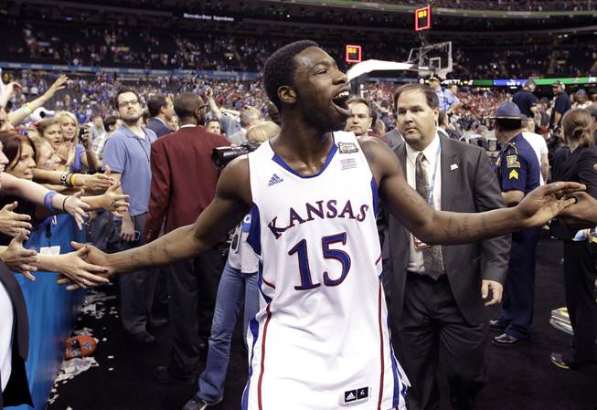 Kansas guard Elijah Johnson (15) celebrates after their 64-62 win over Ohio State in an NCAA Final Four semifinal college basketball tournament game Saturday, March 31, 2012, in New Orleans. 

