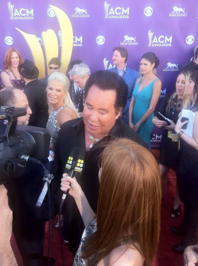 Wayne Newton on the 47th Annual ACM Awards red carpet at MGM Grand Garden Arena on Sunday, April 1, 2012. The beauty to his right is his wife, Kathleen.