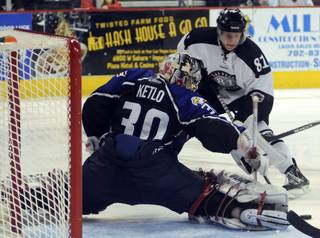 ECHL Second Team All-Star Adam Miller (81) is foiled by the outstretched pad of Colorado goaltender Damien Ketlo during the third period on Saturday night.