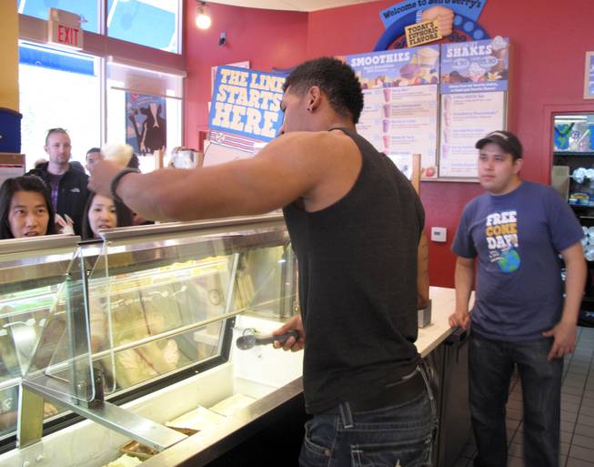 Chippendale Nate Estimada serves free cones at Ben & Jerry's at The District. It was free-cone day to celebrate the company's 34th anniversary. Donations benefited St. Jude's Ranch for Children in Boulder City.