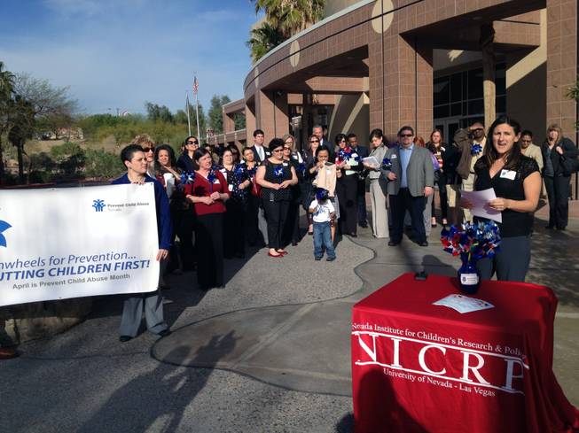 Amanda Haboush, senior research associate at UNLV's Nevada Institute for Children's Research and Policy, introduces the Choose Your Partner Carefully campaign outside the Grant Sawyer Building on Wednesday. Community leaders joined the announcement, which coincided with the start of Child Abuse Prevention Month.