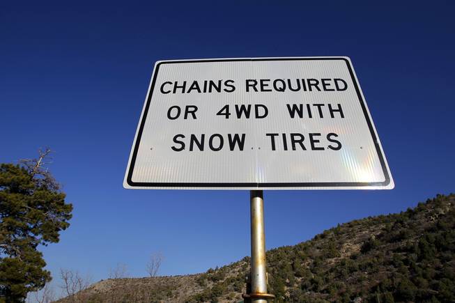 A seasonal road sign warning of road restrictions is shown on Kyle Canyon at the junction of State Route 158 (the road connects Kyle Canyon and Lee Canyon) on Mount Charleston Thursday, April 5, 2012.