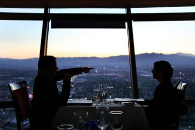 Diners enjoy the view from the Top of the World Restaurant at the Stratosphere on Thursday, April 5, 2012.