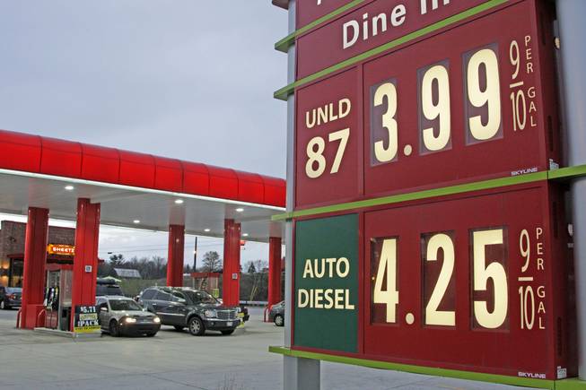 Gas prices are posted at a gas station in Breezewood, Pa., Monday, April 9, 2012. Gasoline prices in the U.S. fell by about a penny over the weekend to $3.927 per gallon. In Nevada, the average was $3.97.