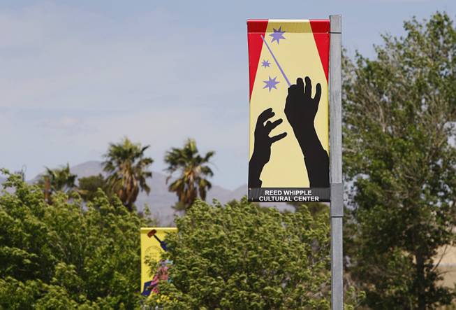 Banners are shown along Las Vegas Boulevard North Thursday, April 11, 2012. "Pole Dancers," created by Las Vegas artist Martin Kreloff, is one of three pieces of art in the Cultural Corridor Trail Improvement Project, which won the Public Art Category award.