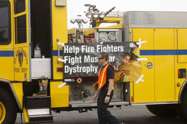 Firefighters prepare for their fundraiser, "Fill The Boot," on Friday April 13, 2012 at the corner of Rainbow and Flamingo .