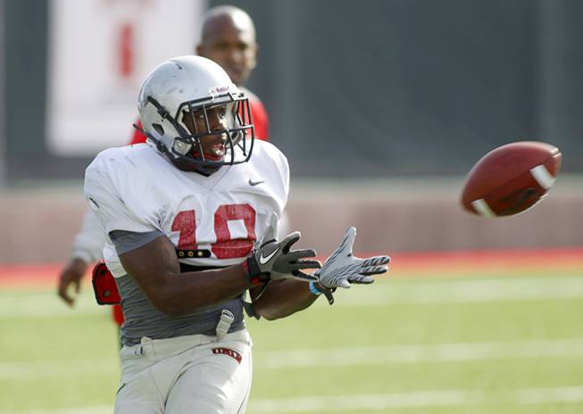 Wide receiver Marcus Sullivan (18) looks in a pass during practice at UNLV's Rebel Field, April 16, 2012.