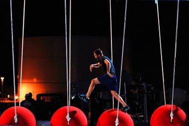 A competitor races across red balls during the taping of the finals of American Ninja Saturday, April 21, 2012.