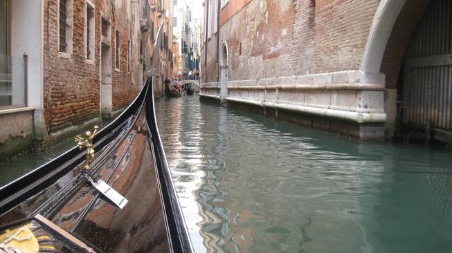 A look from the front of a gondola as we drift through a canal in Venice.