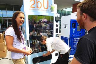 Laura Rengel talks with students while demonstrating a vending machine featuring healthy alternatives during an event at UNLV hosted by the National Automatic Merchandising Association to show off vending machines Tuesday, April 24, 2012.