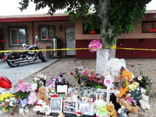 Shown is the memorial on April 25, 2012 that has been made for the mother and daughter found dead inside their home on Robin Street near Washington Avenue. On April 16, 2012, officers responded to the house when a boy, 9, went to school and told staff that his mother and sister were dead at home.