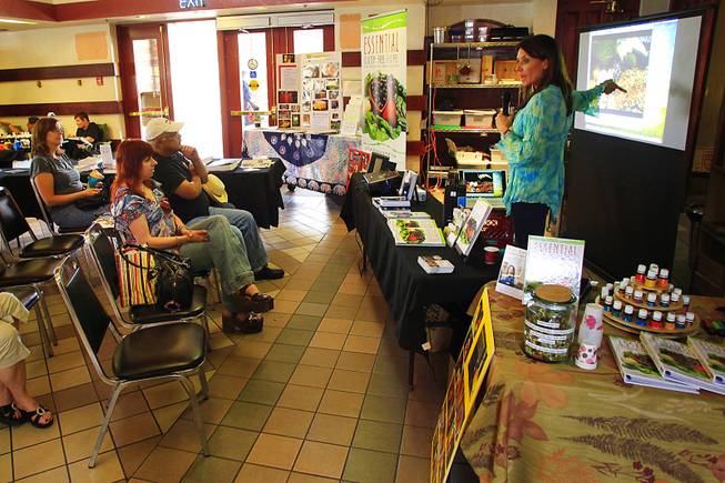 Tara Rayburn teaches a class in healthy cooking at the Downtown 3rd Farmers Market Friday, April 27, 2012.