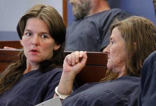 Amber Hall. left, and her mother, Lourie Rodriguez, talk as they wait to be arraigned on charges Tuesday, May 5, 2012, in Las Vegas Justice Court. The two are accused of murdering and robbing Jean Greenburg, a 73-year-old Las Vegas coin collector, on April 27, 2012.