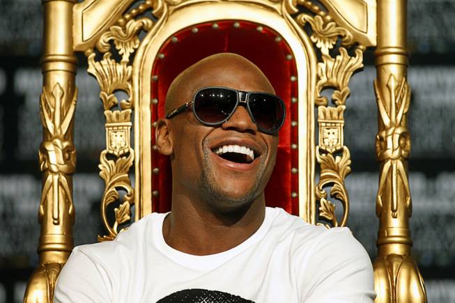 Undefeated boxer Floyd Mayweather Jr. laughs during a news conference at the MGM Grand Wednesday, May 2, 2012. Mayweather will challenge WBA super welterweight champion Miguel Cotto of Puerto Rico for the title at the MGM Grand Garden Arena on Saturday.