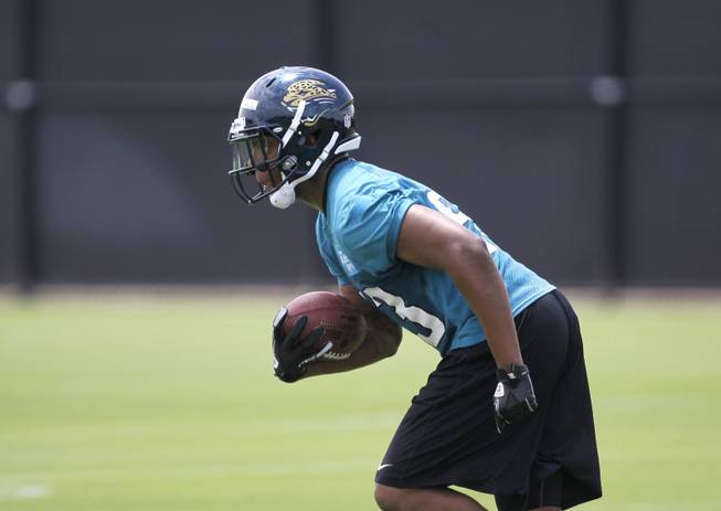 Jacksonville Jaguars linebacker Brandon Marshall runs with the ball during NFL football rookie minicamp,  Friday, May 4, 2012, in Jacksonville, Fla. 