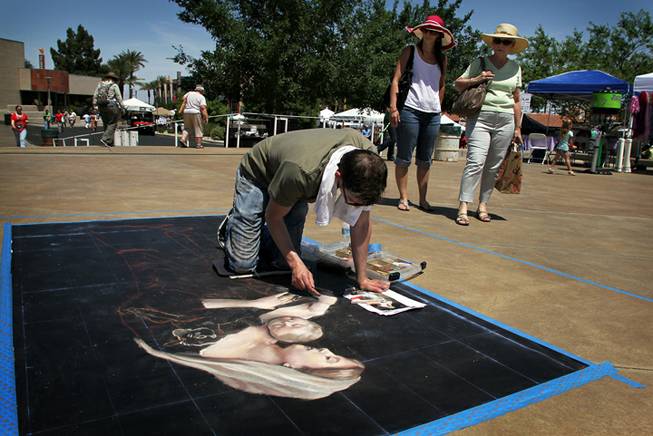 Donovan Fitzgerald, 24, works on his sidewalk chalk composition at the Art Festival of Henderson on Saturday, May 12, 2012. About 50
contestants are participating in the event this year.