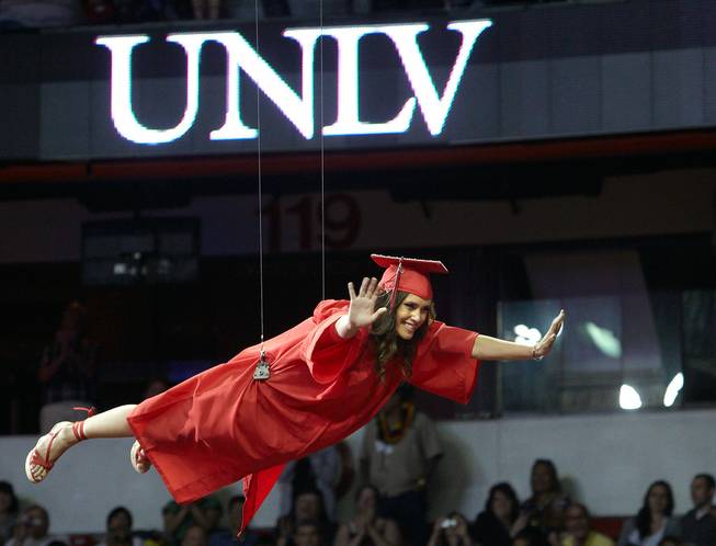 Emily Black, representing entertainment engineering's first graduating class, flies over the crowd during the ceremony on May 12, 2012. (Aaron Mayes/UNLV Photo Services)