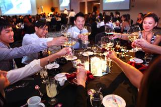 Students from Singapore learn the basics of dining decorum during an etiquette dinner at the Stan Fulton Building at UNLV on Thursday, May 17, 2012.