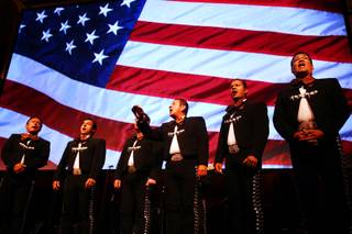 Members of Mariachi Cobre sing the National Anthem during the Las Vegas Latin Chamber of Commerce Mariachi Festival at the Smith Center for the Performing Arts Friday, May 18, 2012.