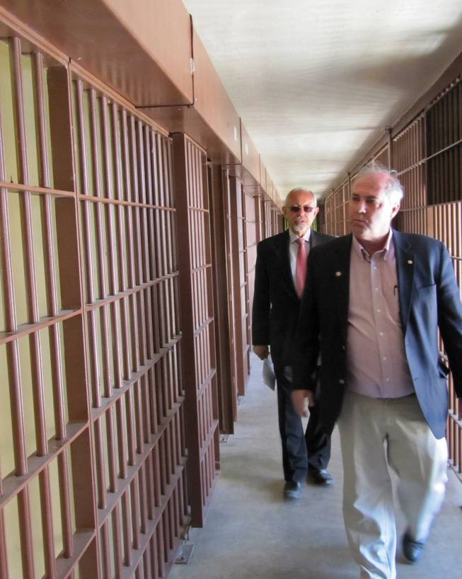 Former Nevada prison directors Robert Bayer, right, and Howard Skolnik, left, tour the Nevada State Prison in Carson City on Friday, May 18, 2012, after a decommissioning ceremony. The last inmates left months ago, and now the 150-year-old prison is being officially taken out of service.
