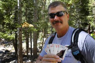 Branch Whitney, founder of the 52 Peak Club, poses with customized playing cards during a hike to Big Falls at Mt. Charleston Tuesday, May 22, 2012. Members of the hiking club try to climb 52 peaks around Southern Nevada. Each card represents a different peak. All of the peaks are within 60 minutes of The Strip, Whitney said.