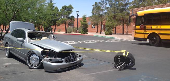 High school students who attended Clark County Commissioner Lawrence Weekly's 11th Annual Teen Town Hall were greeted by this wrecked vehicle outside the county government center Friday morning. The car had a message affixed to its side: Don't text and drive.