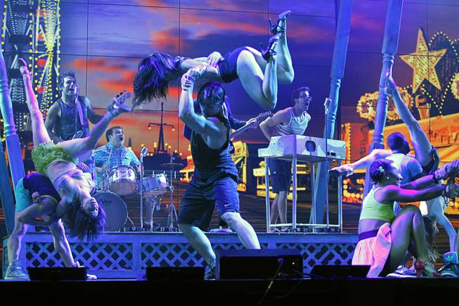 Cast members, including Nikki Tuazon (center, top) and Colt Prattes (center, bottom), perform in the "Dance, Dance, Dance" scene during a media preview of "Surf the Musical" at Planet Hollywood on Tuesday, May 29, 2012. The new production show, featuring the songs of The Beach Boys, is expected to open at the resort in mid-June.
