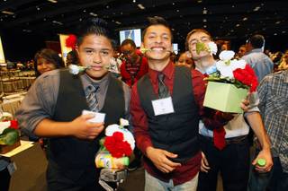 Del Sol High School students, including Andy Escamillo, left, and Julio Veano, center, celebrate during an event, sponsored by MGM Resorts International, recognizing the achievements of about 500 high school students at MGM Grand Thursday, May 31, 2012. The event highlighted the impact of the Reclaim Your Future initiatives implemented by CCSD through the support of community partners, volunteers and staff. The initiatives assist students whose attendance, credits or proficiency exam results put them at risk not to graduate.